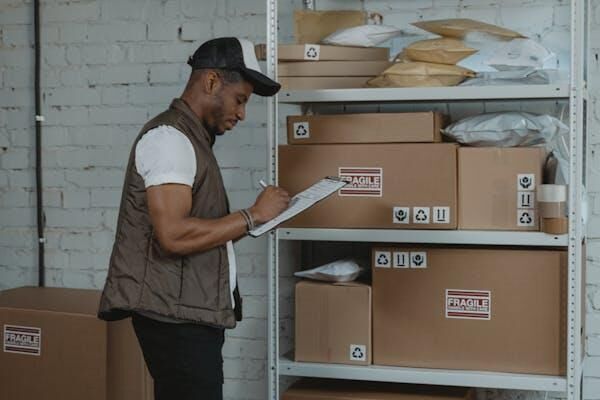 Man checks status of packages that are packed using polyeurethane foam